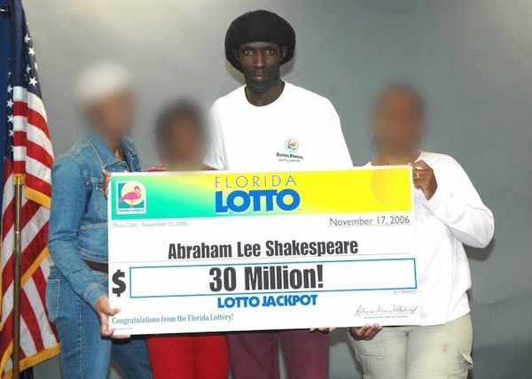 Abraham Lee Shakespeare Holding Large Cheque with Three Other People