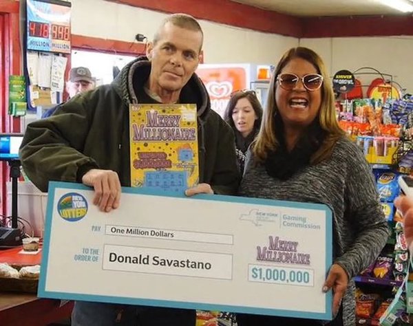 Donald Savastano Holding Large Novelty Cheque