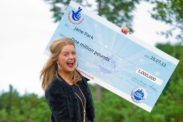 Jane Park Holding Large Novelty Cheque