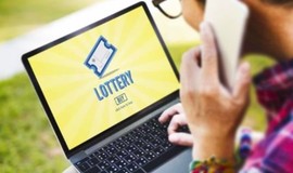Man Using Lottery Site on a Laptop