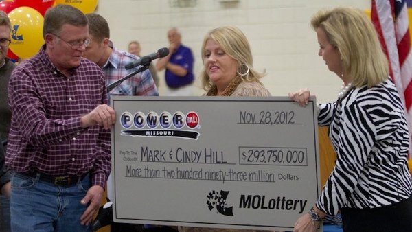 Mark and Cindy Hill Holding Oversized Cheque