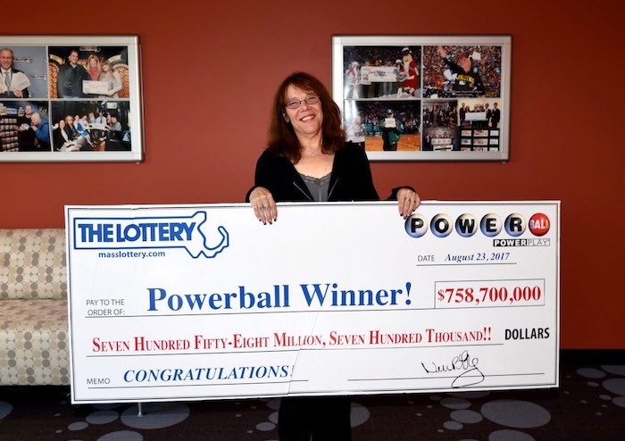 Mavis Wanczyk Holding Large Winning Lottery Check