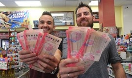 Two Guys Holding Lottery Tickets
